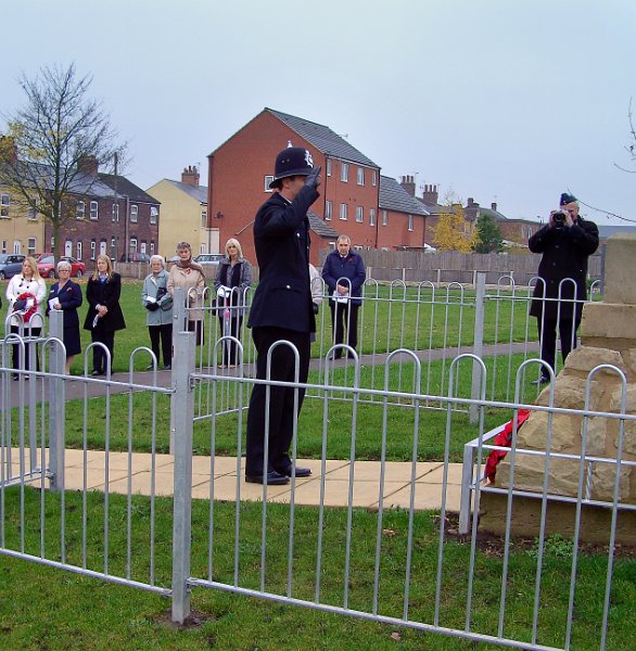 519-A Police.jpg - 519-A Police Constable pays his respect after laying a wreath.